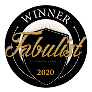 Gold writing for the 2020 Fabulist Winner is on a black shield and circle emblem.